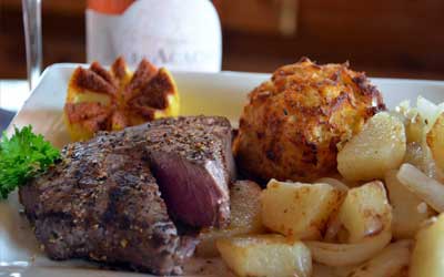 https://pinelodgesteakhouse.com/wp-content/uploads/McHenry-Md-Steak-and-Crab-Cake-Seafood-Deep-Creek-.jpg?utm_source=chatgpt.com